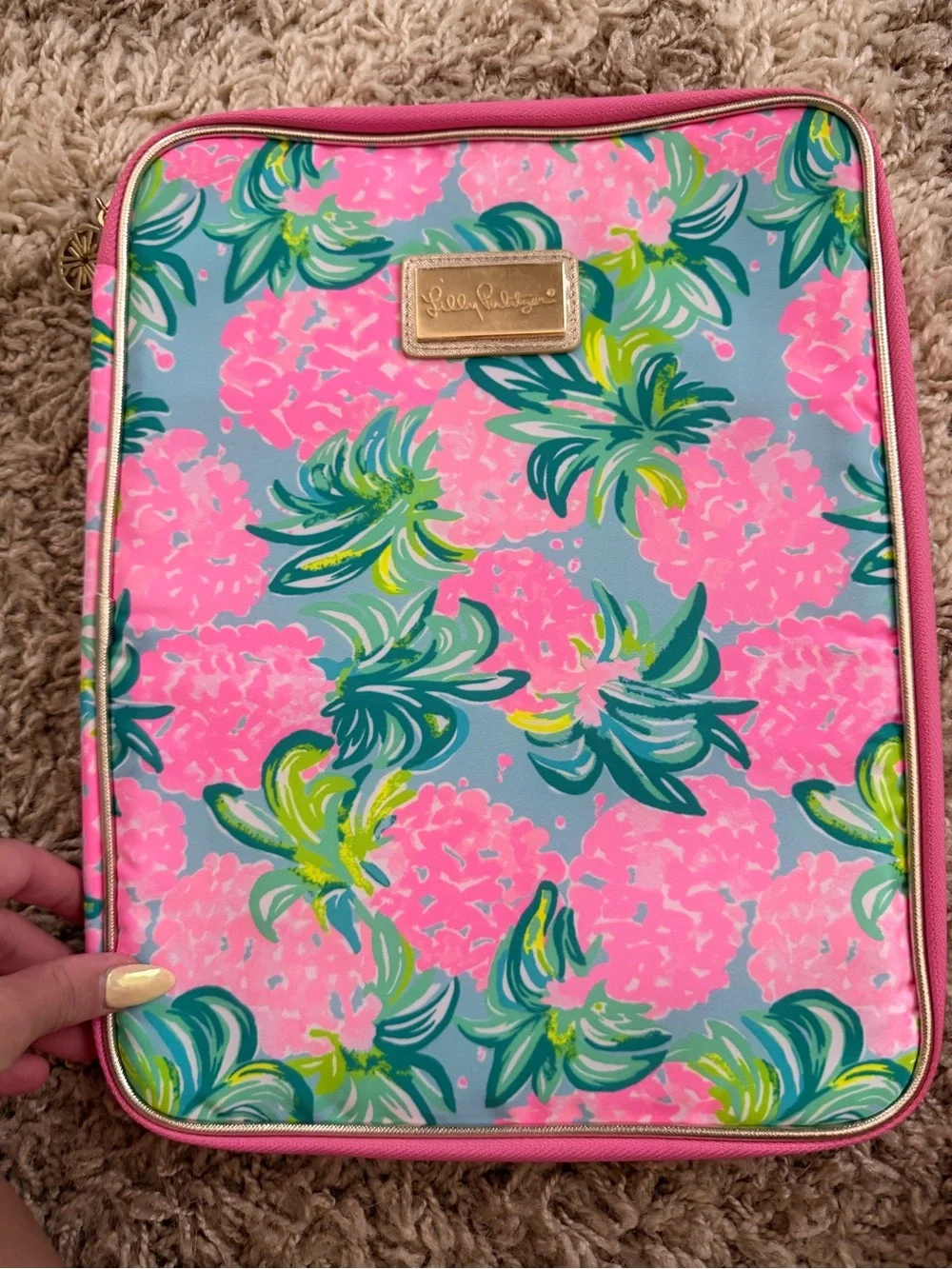 Women's floral pouch with brand plaque